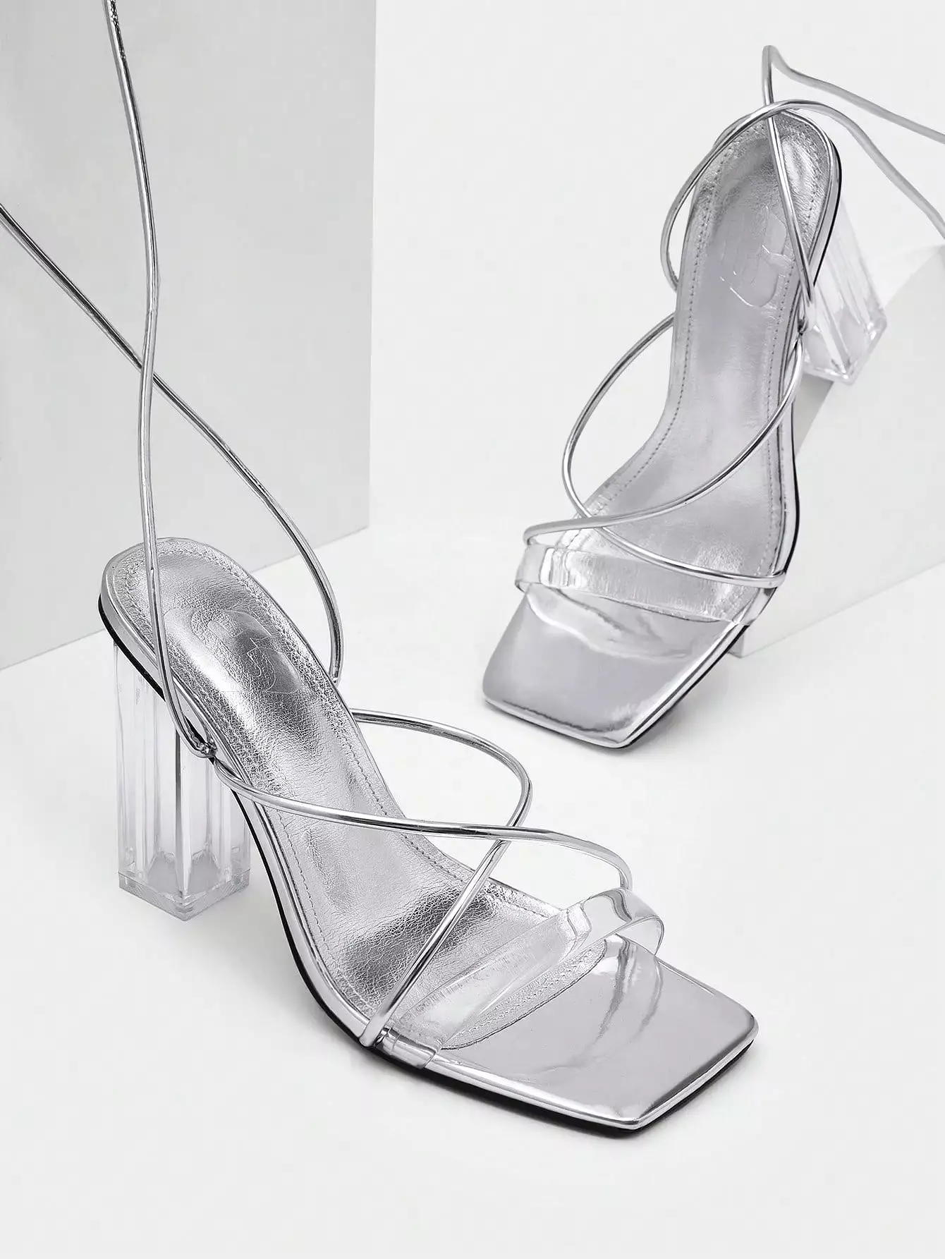 Metallic chunky heeled strappy sandals for women, perfect for glamorous parties.